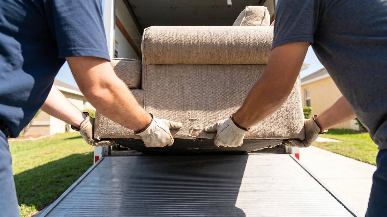 A junk removal crew loading a truck in Santa Ana, CA